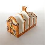 This cottage-shaped toast rack will be available in the auction